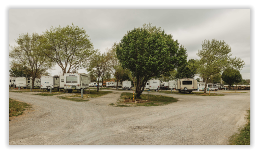 x-press rv sites with fifth wheels and trees at Xpress RV Park